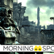 A person in heavy power armor looks over a ruined post apocalyptic city landscape in Fallout 3.